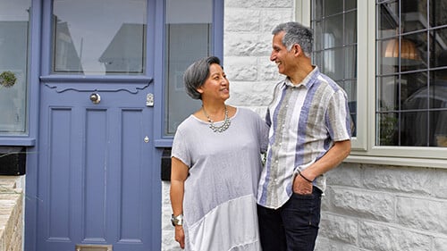 Smiling homeowner couple.